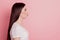 Profile side view portrait of sweet attractive lovely pretty girl sending air kiss isolated over pink background