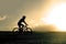 Profile silhouette sport man riding cross country mountain bike