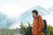 Profile of smiling mountaineer looking at astonishing snowy summits view