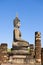 Profile view of an ancient Buddha sculpture on the ruins of the Wat Chana Songkram temple. Sukhothai