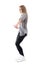 Profile view of blonde woman dancing jazz dance in trendy modern clothes.