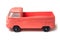 Profile view of orange Volkswagen van toy miniature on white background