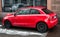 Profile view of red Audi A1 parked in the street, Audi is the famous german brand of cars
