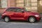 Profile view of red Chrysler Cruiser parked in the street