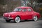 Profile view of red Renault Dauphine vintage parked in the street