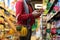 Profile view of unrecognizable customer buying food at store