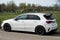 Profile view of white Mercedes A 180 parked on countryside road