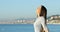 Profile of a woman breathing smiling on the beach