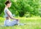 Profile of woman in lotus position zen gesturing