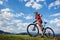 Profile of young athletic tourist biker in professional sportswear starting to cycle a bike