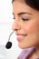 Profile young female receptionist wearing headset