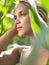 Profile of young woman in corn field closed eyes