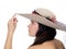 Profile of young woman with finger to hat