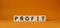 Profit symbol. Concept word Profit on wooden cubes. Beautiful orange background. Business and Profit concept. Copy space
