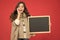 Profitable deal. Happy girl blank blackboard. copy space. Important information. Winter activity advertisement. Time for