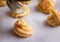 Profiteroles cooking, dough on a baking paper