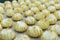 Profiteroles on a culinary tray in a confectionery shop