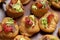 Profiteroles with pate, decorated with green salad, tomato and onion.