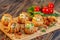 Profiteroles with vegetable filling, tomatoes and herbs