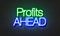 Profits ahead neon sign on brick wall background.