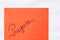 Progress handwriting text close up isolated on orange paper with copy space. Writing text on memo post reminder