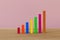 Progress or success concept. Arrange color wood bar graph on a table. Risk management business financial and managing investment