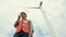 Progressive engineer working with the wind turbine, with the sky as background.