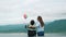 A progressive woman and her son are on vacation at the natural beauty of a lake