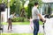 Progressive young happy family living in a home with an electric car.