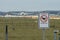 Prohibition sign at the fence of an airport `No Drone Zone`