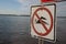 Prohibition sign swimming. No swimming allowed sign. Please don`t swim on the lake warning sign. Red indication informing to not s