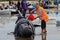 Project Jonah volunteer tending a stranded pilot whale on Farewell Spit, New Zealand