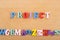 PROJECT word on wooden background composed from colorful abc alphabet block wooden letters, copy space for ad text. Learning