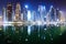 Promenade and canal in Dubai Marina at night with luxury skyscrapers around,United Arab Emirates