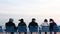 Promenade des anglais, Tourists and elderly man looks at the sea on the Cote d`Azur in winter