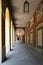 Promenade with long arcade columns surrounding Hofgarten Park in Munich, Germany