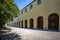 Promenade with long arcade columns surrounding Hofgarten Park in Munich, Germany