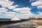 Promenade of the Malecon of Havana, Morro Castle and its lighthouse with crashing waves