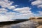 Promenade of the Malecon of Havana, Morro Castle and its lighthouse with crashing waves