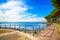 Promenade and pine trees in Bolsena lake, Italy.