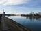 Promenade by the river Drava and pedestrian bridge during a sunny evening