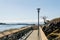 Promenade seafront or esplanade in british columbia harbor with blue clear sky