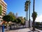Promenade with shops overlooking the quiet beach in November in Marbella Andalucia Spain