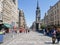 Prominent Tron Church clock tower and spire in Royal Mile crowded with tourists