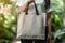 Promoting eco friendly living Woman holds blank canvas shopping bag
