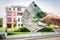 Property buyer holding euro banknotes - real estate concept