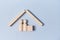 Property investment mockup. Mortgage, buying and selling real estate template. Wooden figures and cube under house roof