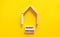 Property portfolio symbol. Concept words Property portfolio on beautiful wooden blocks. Wooden model of house. Beautiful yellow