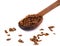 Propolis granules in a wooden spoon. Bee glue. Bee products. Apitherapy.