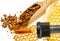 Propolis tincture and a wooden spoon of propolis granules